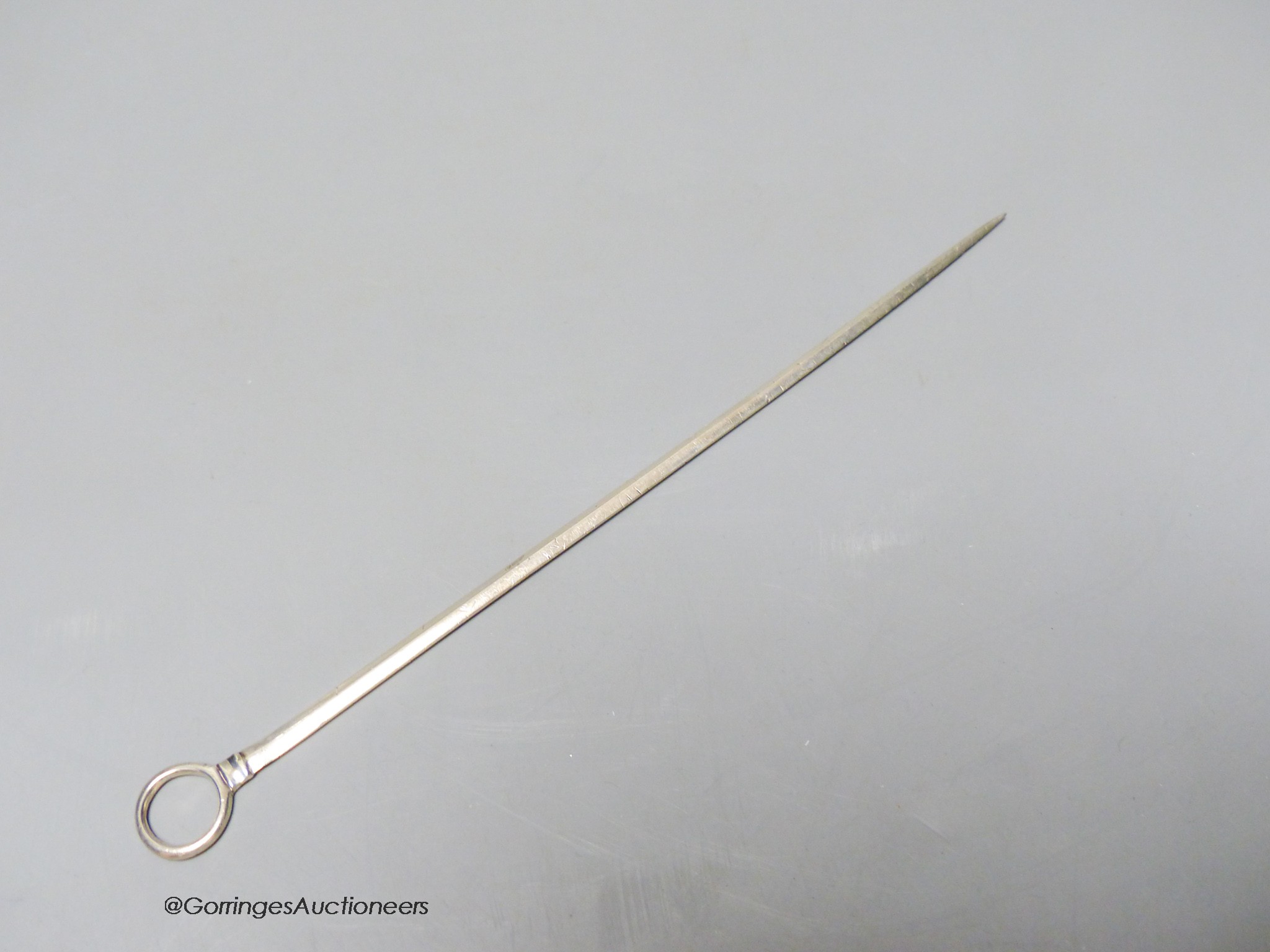 A George III white metal game skewer, unmarked, 22cm.